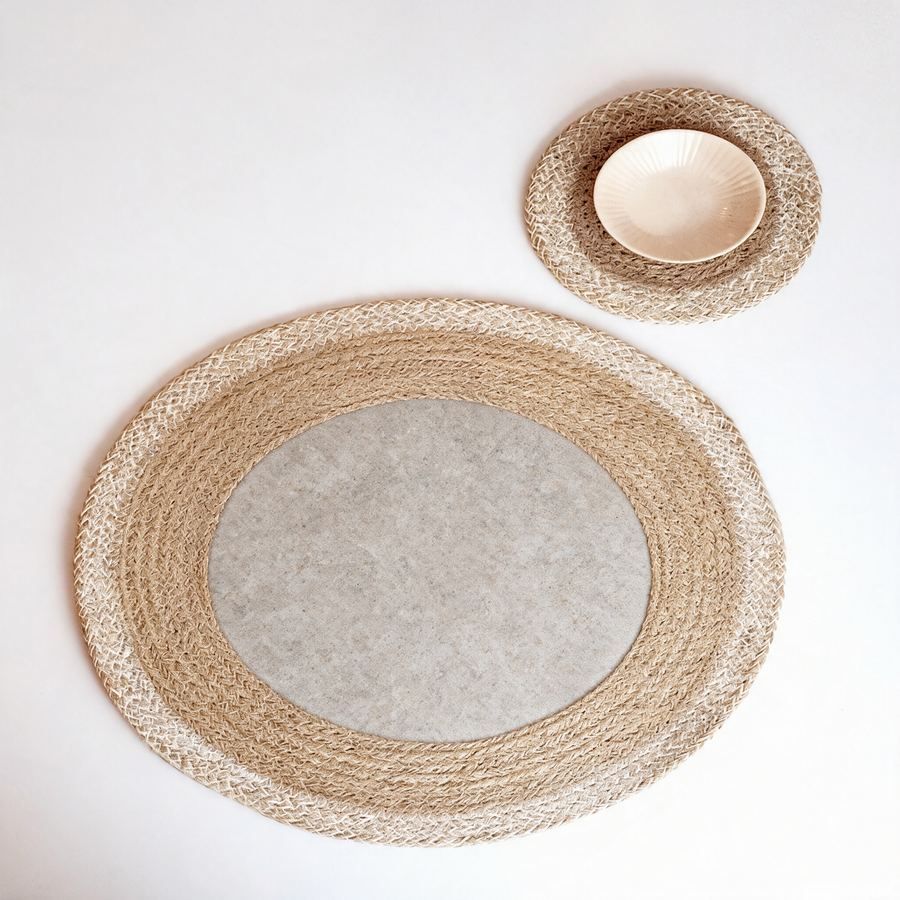 Jute coasters on a warm grey studio background