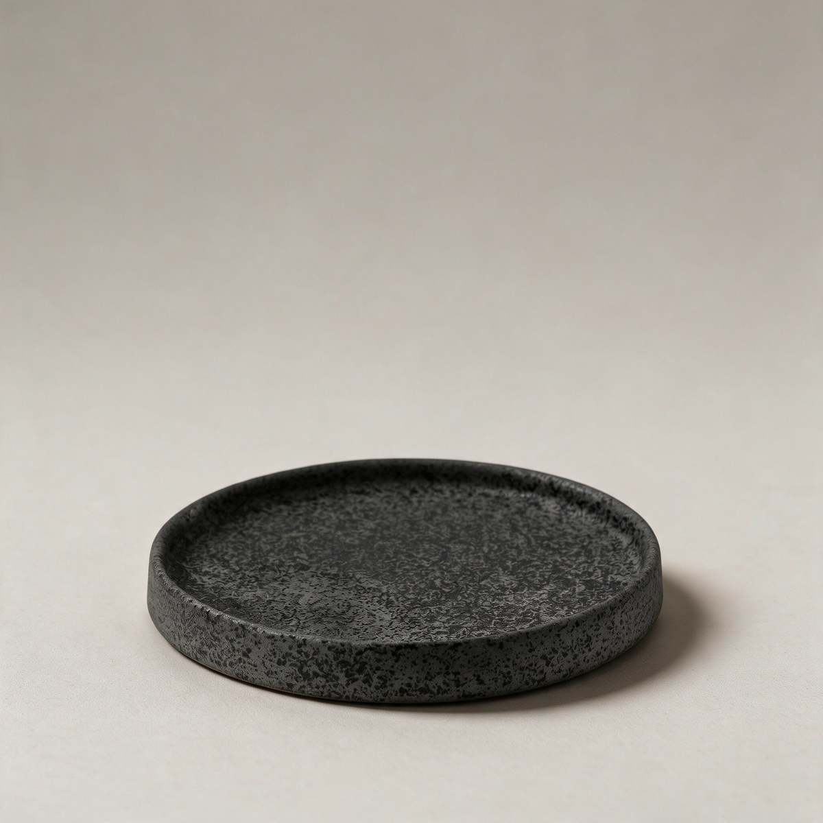 Ceramic Plate, Vulcan — restaged on warm grey studio seamless