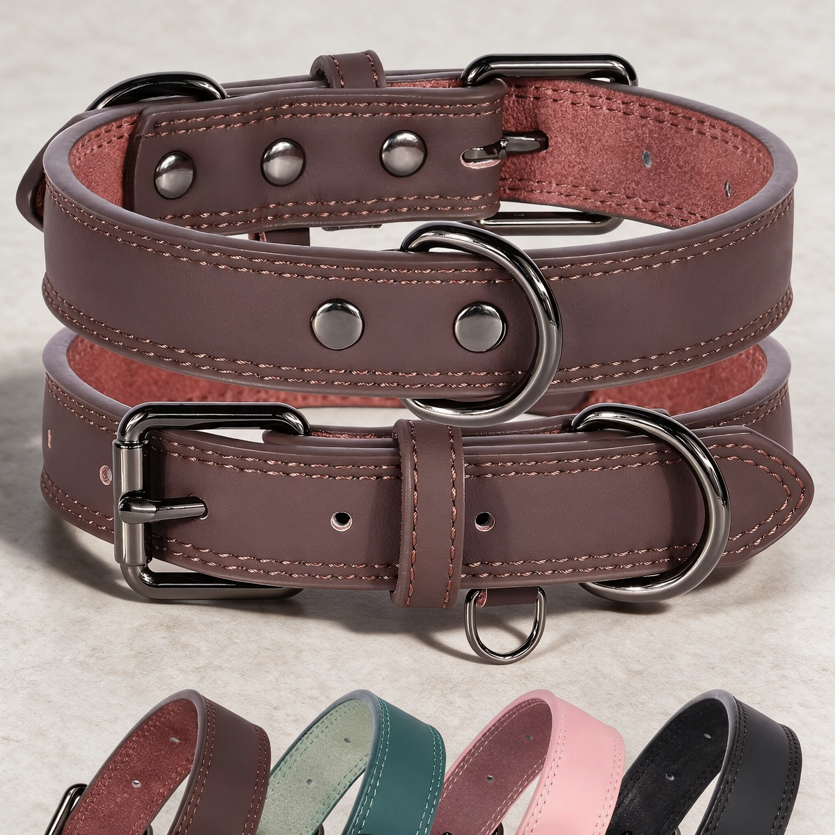 Leather dog collar on a warm grey studio background