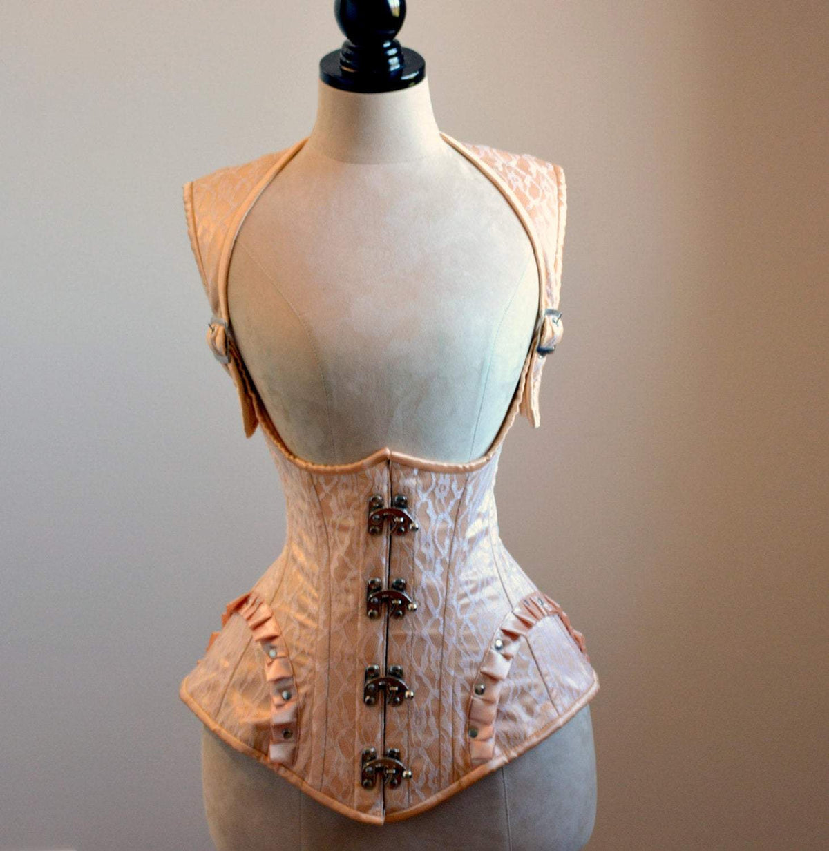The steampunk corset vest of the set, front view showing the collar and busk clasps