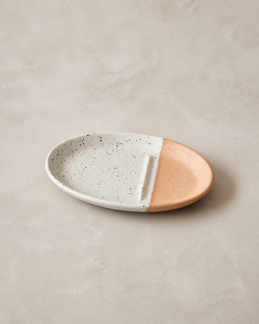 ALCOVE No. 15 oval terracotta ceramic plate on warm grey background